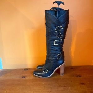 BCBG Maxazria  black leather knee high boot. Brass buckles size 9